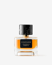 Perfume bottle with black cap and label on a white background
