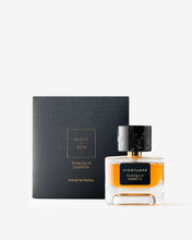 Eight & Bob perfume bottle with black cap and gold label next to a black box on a white background