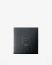 Black perfume box with gold text on a white background
