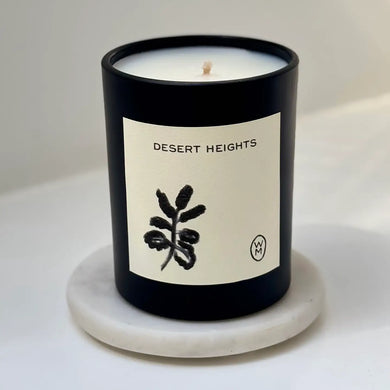 Candle labeled 'Desert Heights' on a white background