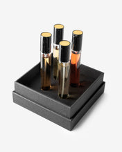 Eight & Bob Set of four perfume bottles in a black box on a white background