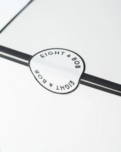 Close-up of a product with 'Eight & Bob' branding on a white background