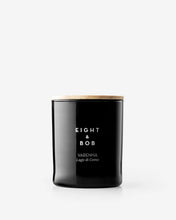 Black candle with 'Eight & Bob' branding on a white background