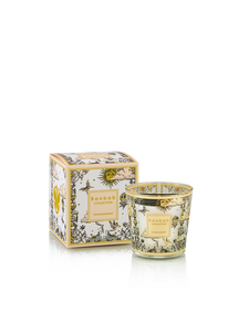 Candle with decorative box featuring floral design on a white background