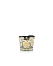 Decorative candle with intricate design on a white background