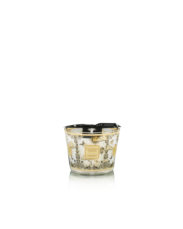 Decorative candle with intricate design on a white background