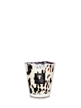 Candle with a black and white  print design on a white background