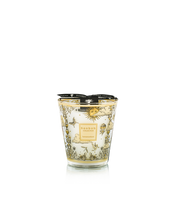 Decorative candle with intricate design on a white background