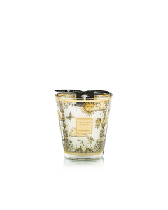 Decorative candle with intricate design on a white background