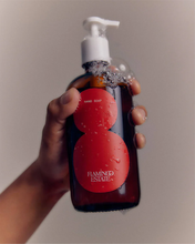 Hand holding Flamingo Estate Roma Heirloom Tomato Liquid Hand Soap