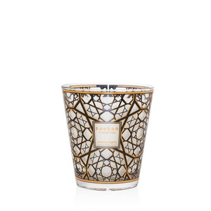 Decorative candle with geometric pattern on a white background