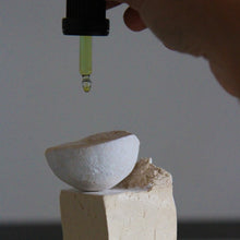 AOIROA hand applying oil to HAKUDO MOON CERAMIC objects