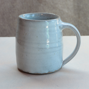 Matt Fishman Pottery white ash glaze mug on counter