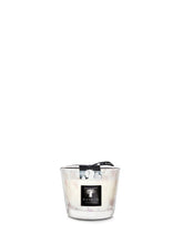 Candle in a glass holder with a black label on a white background