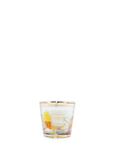 Candle with a decorative label on a white background