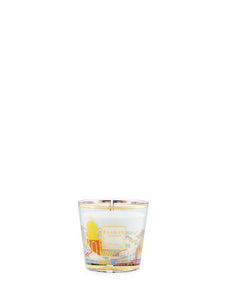 Candle with a decorative label on a white background