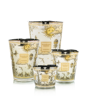 Set of decorative candles with celestial designs on a white background