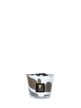 Candle in a glass holder with a decorative label on a white background