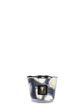 Candle with a decorative label on a white background