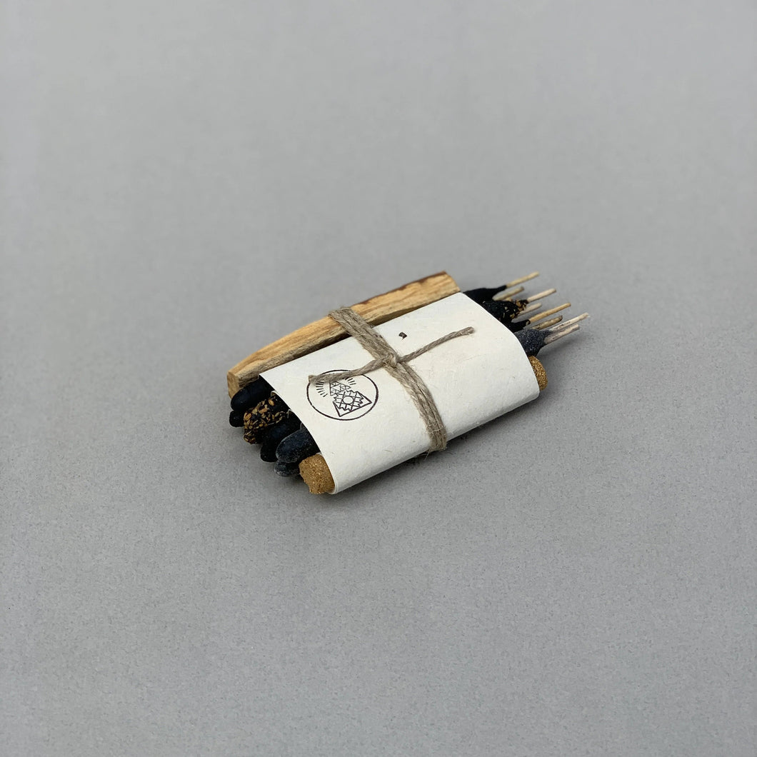 Roll of incense with a label on a gray background