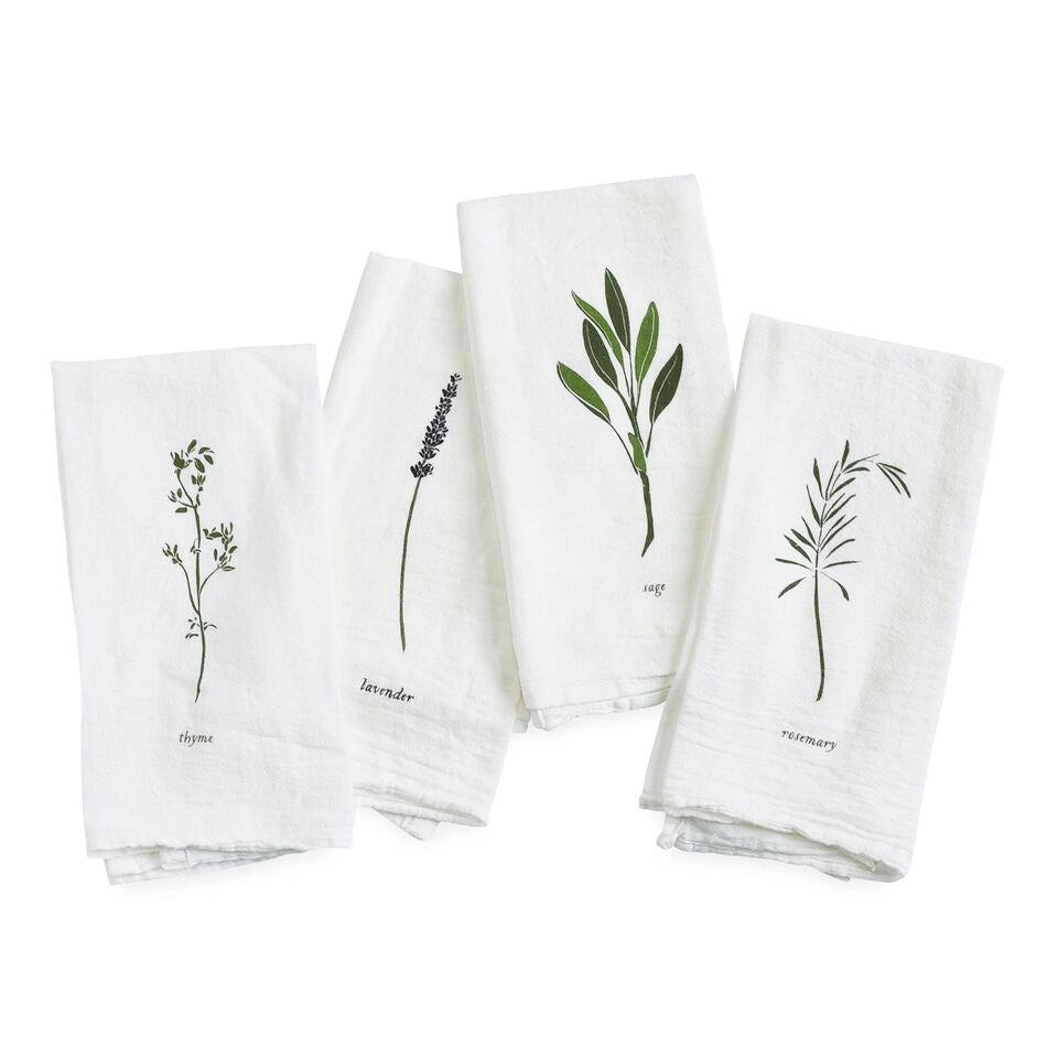 Four white napkins with botanical illustrations and labels on a white background