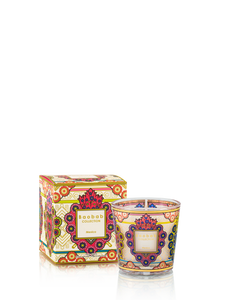 Decorative candle with matching box featuring intricate designs on a white background