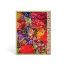 Jigsaw puzzle box with colorful floral design and 'Piecedwork Puzzles' text.