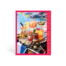Jigsaw puzzle box with a scenic outdoor setting featuring drinks and food.