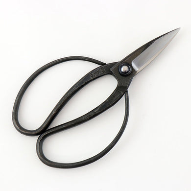 Black-handled scissors on a white background