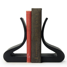 Ogasawara Cast Iron Bookends supporting two books. 