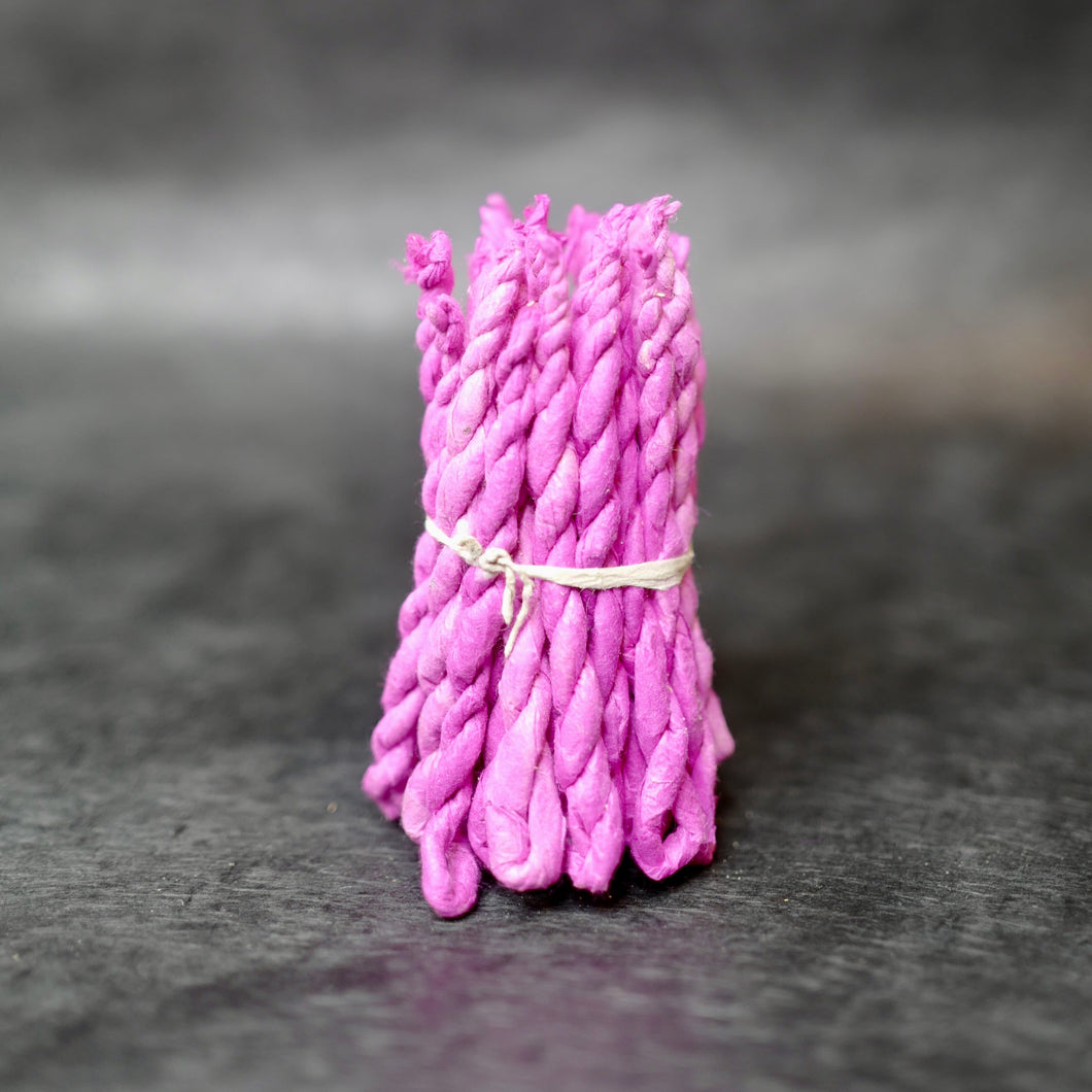 Nepali Frankincense Rope Incense wrapped in magenta paper. 