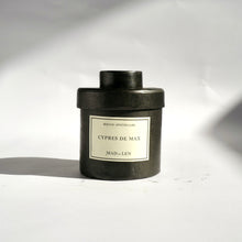 Black metal cylinder Mad et Len Candle Apothicaire Petite - CYPRESS DE MAX - with matching lid cover. 
