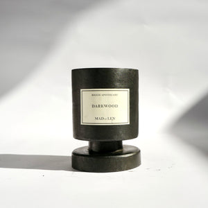 Mad et Len Candle Apothicaire Petite - Darkwood - sitting on the lid. 