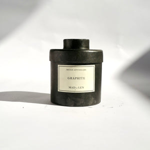 Black metal cylinder Mad et Len Candle Apothicaire Petite - GRAPHITE - with matching lid. 