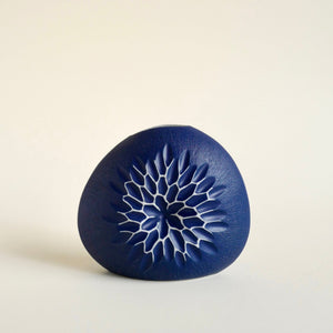 A front view of the small DIVA II Round Porcelain Bud Vase. 