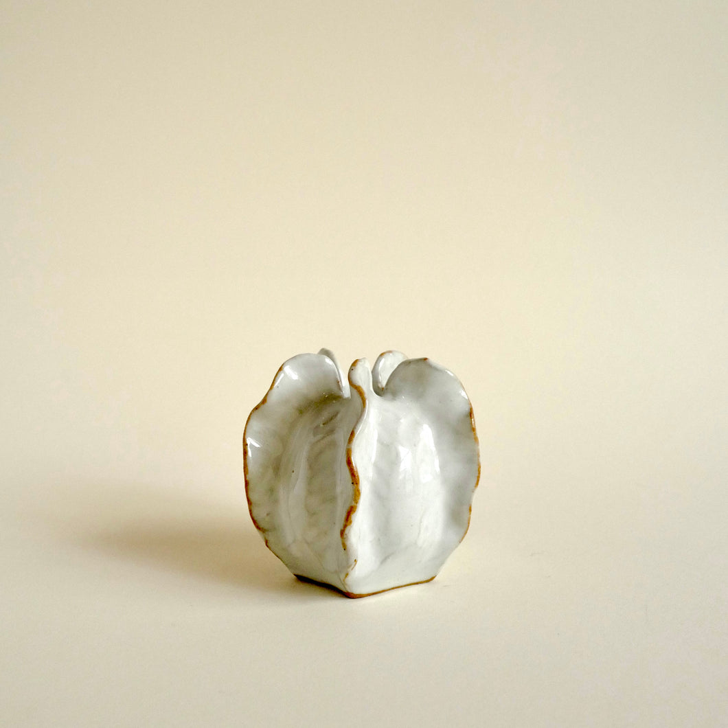 Ceramic Mini White Luffa Vase in white glossy glaze in a shape of an ocean object. 