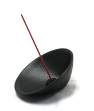 Cast Iron Rocking Incense Holder with incense stick. 