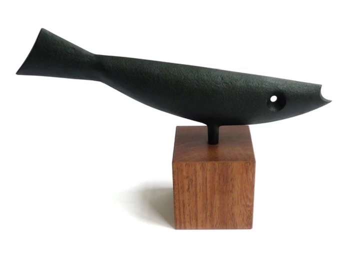 Cast Iron Ornament Fish No. 1 attached to a wooden pedestal. 