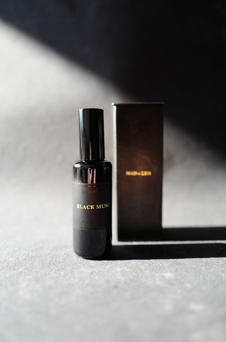 Mad et Len Eau de Parfum Black Musc bottle with metal box packaging. 