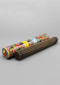 Blue Heaven Bhutanese Incense in bold graphic cylindrical container. Incense wrapped in a bundle. 