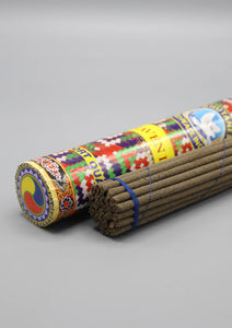 Blue Heaven Bhutanese Incense in bold graphic cylindrical container. Incense wrapped in a bundle. 