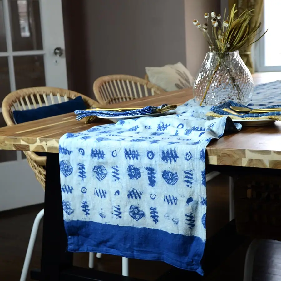 An indigo blue and white with block printing on a table setting. 