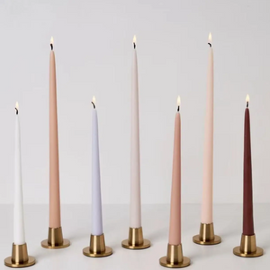 Seven Prima Brass Taper Candle Holder holding earthy pastel color candles. 