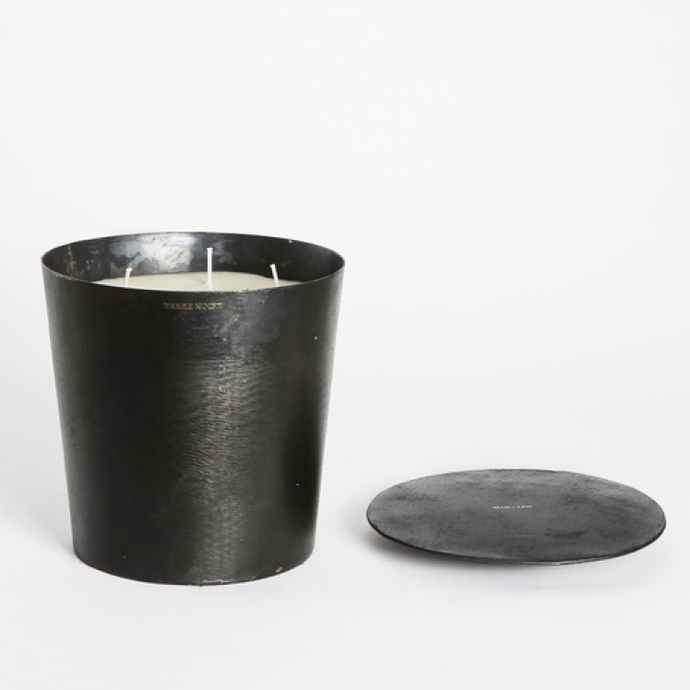 Black tapered metal Mad et Len Grande Vestimentale Candle four wick with black metal lid on the side. 