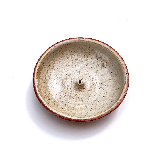 Incausa Stoneware Woodfired Holder in plain background. 